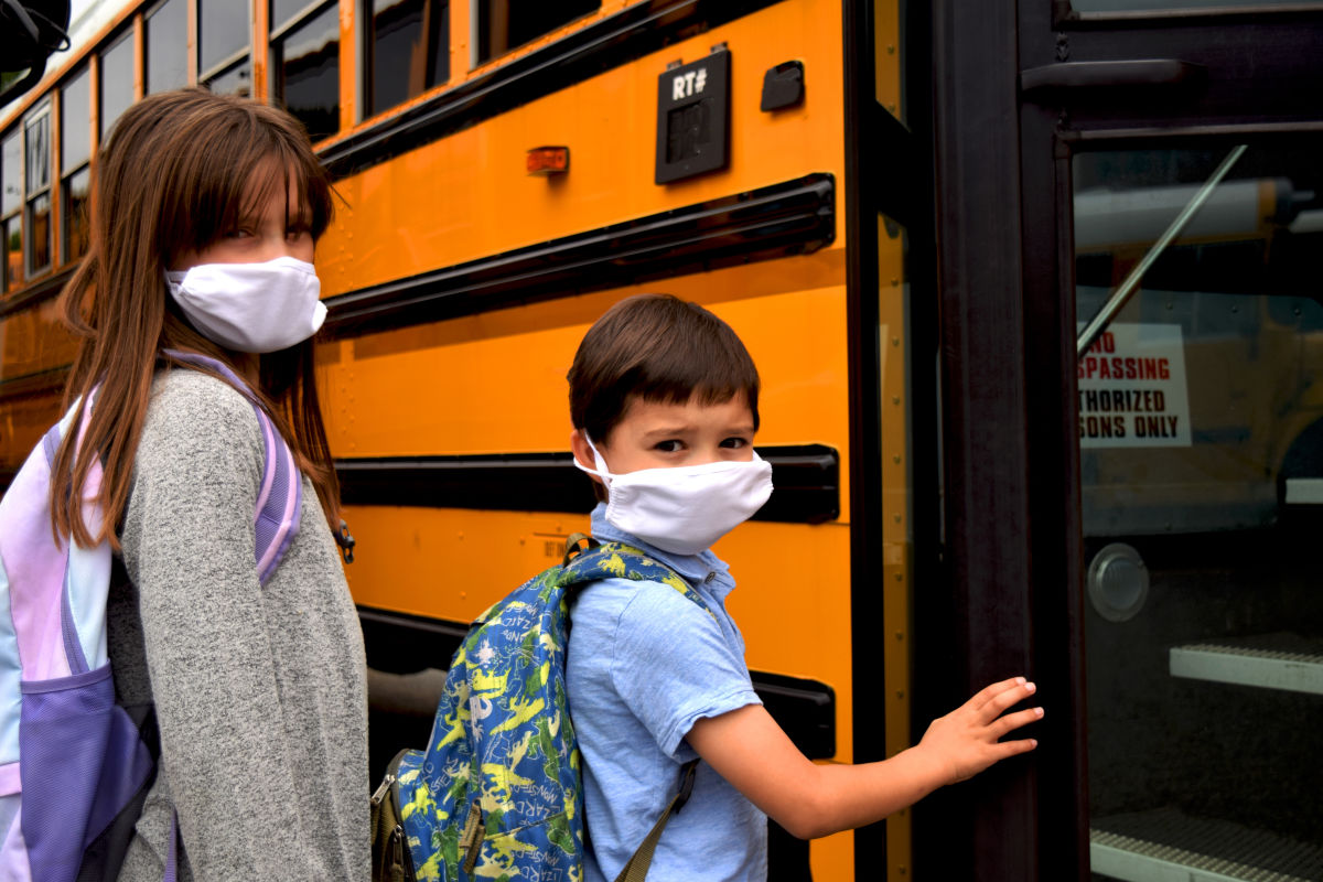 Masked Kids Getting on Bus